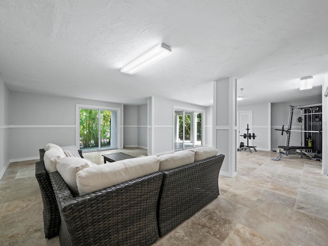 3959 Somerset Dr, Sarasota, FL 34242 - living area featuring light stone finish floors and baseboards