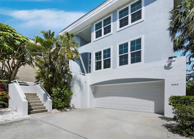 3959 Somerset Dr, Sarasota, FL 34242 - view of front of home with stucco siding and concrete driveway