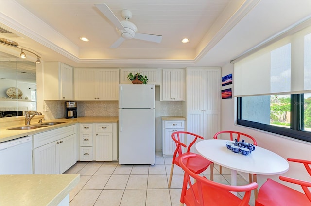 6840 Midnight Pass Rd Unit 6840, Sarasota, FL 34242 - kitchen featuring white appliances, tasteful backsplash, light tile patterned flooring, light countertops, and ornamental molding