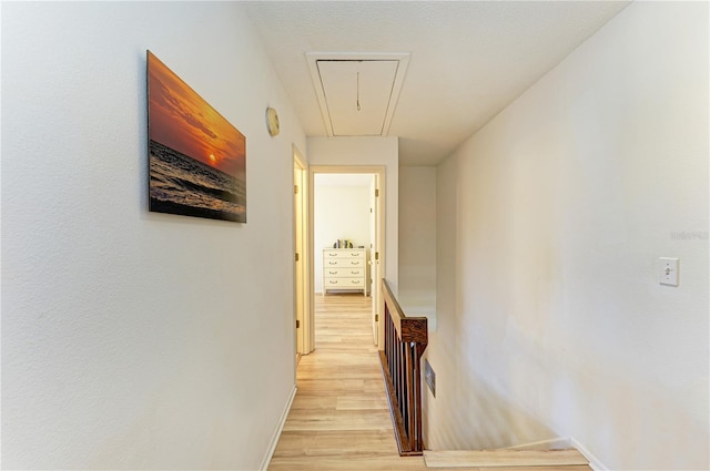 6840 Midnight Pass Rd Unit 6840, Sarasota, FL 34242 - corridor with attic access, light wood-type flooring, and an upstairs landing