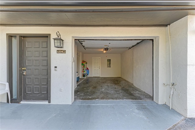 6840 Midnight Pass Rd Unit 6840, Sarasota, FL 34242 - garage featuring electric panel and a garage door opener