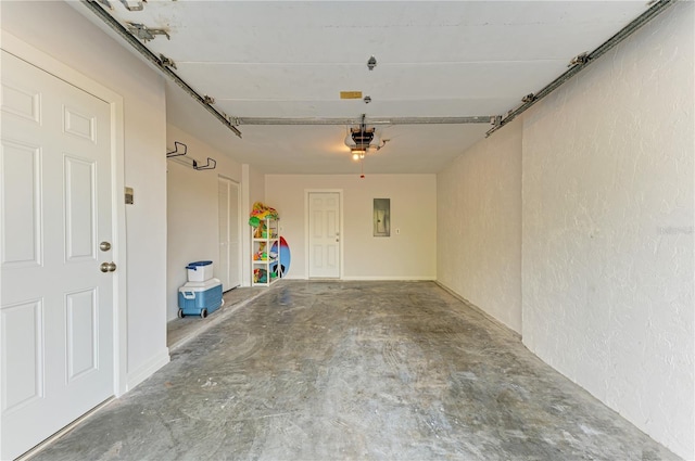 6840 Midnight Pass Rd Unit 6840, Sarasota, FL 34242 - garage featuring a garage door opener, electric panel, and a textured wall