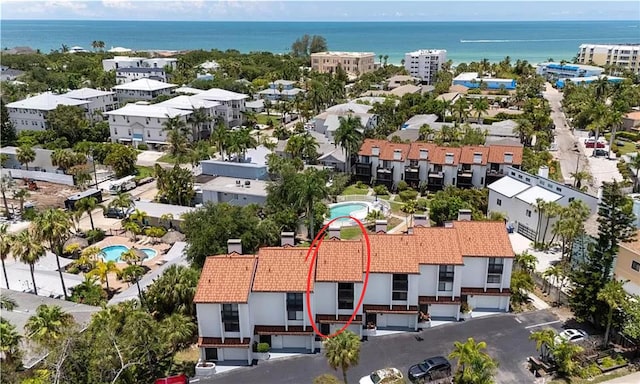 6840 Midnight Pass Rd Unit 6840, Sarasota, FL 34242 - drone / aerial view of a large body of water and a pool area