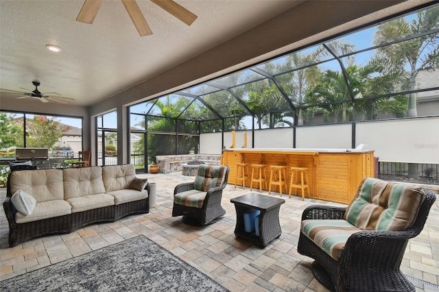 5802 Alabaster Stone Ln, Apollo Beach, FL 33572 - view of patio / terrace featuring outdoor lounge area, ceiling fan, and glass enclosure