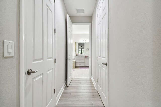 5802 Alabaster Stone Ln, Apollo Beach, FL 33572 - corridor with light wood-style flooring