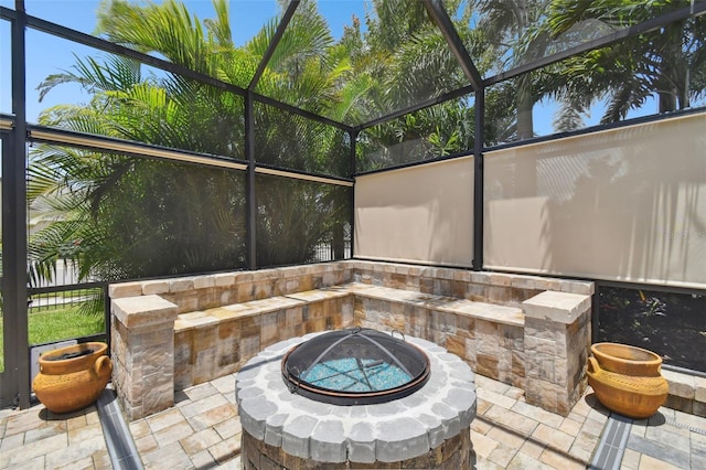 5802 Alabaster Stone Ln, Apollo Beach, FL 33572 - view of patio / terrace featuring a fire pit and glass enclosure