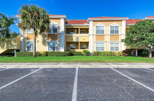 3005 Chianti Ct Unit 103, Sarasota, FL 34237 - view of building exterior with uncovered parking