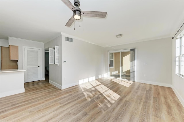 3005 Chianti Ct Unit 103, Sarasota, FL 34237 - unfurnished living room with ornamental molding, a ceiling fan, and light wood-style flooring