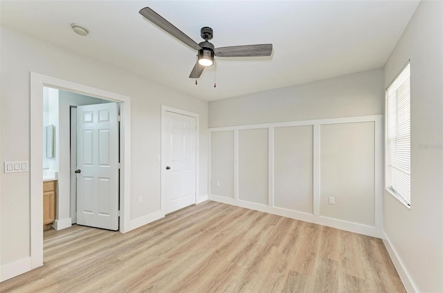 3005 Chianti Ct Unit 103, Sarasota, FL 34237 - unfurnished bedroom featuring light wood-style flooring and ceiling fan