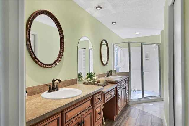 175 Inlets Blvd Unit 175, Nokomis, FL 34275 - full bathroom with a shower stall, vanity, and a textured ceiling