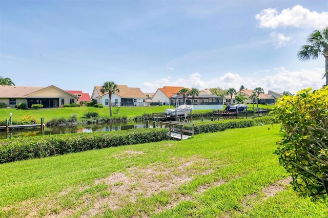 175 Inlets Blvd Unit 175, Nokomis, FL 34275 - view of green lawn featuring a residential view and a water view