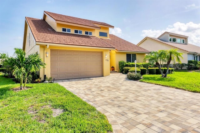 175 Inlets Blvd Unit 175, Nokomis, FL 34275 - view of front of home with a front lawn, stucco siding, and decorative driveway