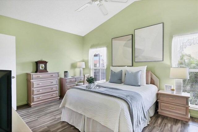 175 Inlets Blvd Unit 175, Nokomis, FL 34275 - bedroom with lofted ceiling, wood finished floors, multiple windows, and ceiling fan