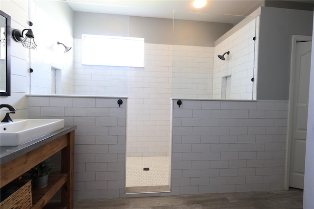 5419 Lakehurst Ct, Palmetto, FL 34221 - full bathroom with a walk in shower, vanity, wood finished floors, and tile walls