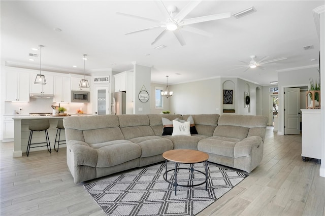 5419 Lakehurst Ct, Palmetto, FL 34221 - living area with ceiling fan, light wood finished floors, crown molding, a chandelier, and recessed lighting