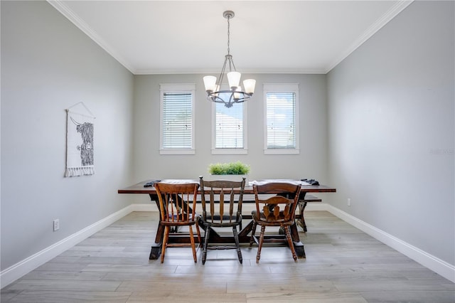 5419 Lakehurst Ct, Palmetto, FL 34221 - dining area featuring a chandelier, crown molding, breakfast area, and light wood finished floors