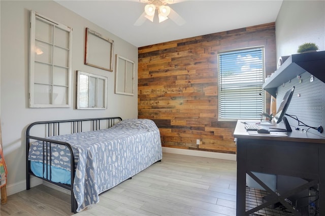 5419 Lakehurst Ct, Palmetto, FL 34221 - bedroom with wooden walls, an office area, light wood-style flooring, and ceiling fan