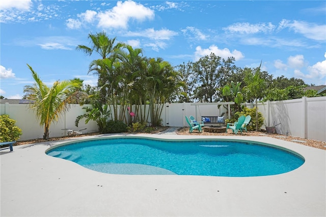 5419 Lakehurst Ct, Palmetto, FL 34221 - view of swimming pool featuring a fire pit, a fenced backyard, and a patio area