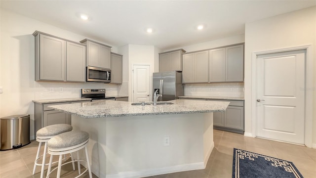 17817 Pastureland Ave, Lakewood Ranch, FL 34211 - kitchen featuring stainless steel appliances, gray cabinetry, decorative backsplash, and recessed lighting
