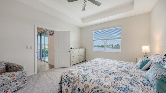 17817 Pastureland Ave, Lakewood Ranch, FL 34211 - bedroom with light carpet, ceiling fan, and a raised ceiling