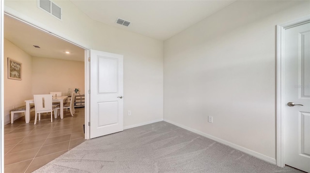 17817 Pastureland Ave, Lakewood Ranch, FL 34211 - empty room featuring tile patterned flooring and carpet flooring
