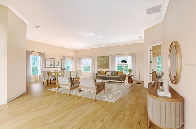 5839 Los Verdes Ct, Bradenton, FL 34210 - living room featuring light wood-style floors and ornamental molding