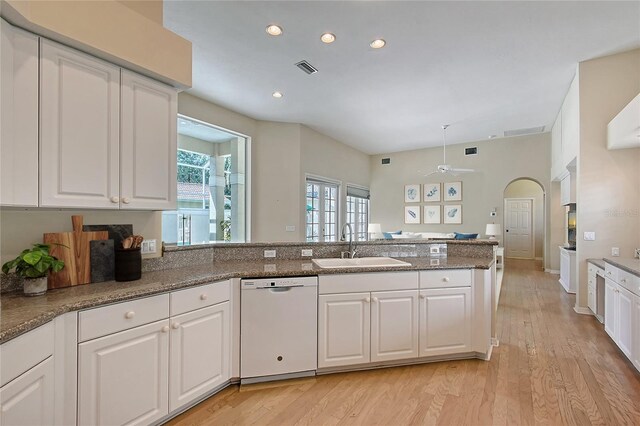 5839 Los Verdes Ct, Bradenton, FL 34210 - kitchen with white dishwasher, ceiling fan, a peninsula, white cabinets, and recessed lighting