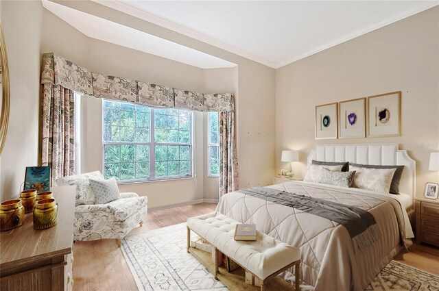 5839 Los Verdes Ct, Bradenton, FL 34210 - bedroom featuring wood finished floors and ornamental molding