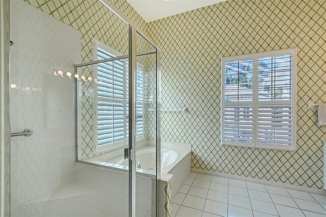 5839 Los Verdes Ct, Bradenton, FL 34210 - bathroom with tile patterned flooring, wallpapered walls, a shower stall, and plenty of natural light