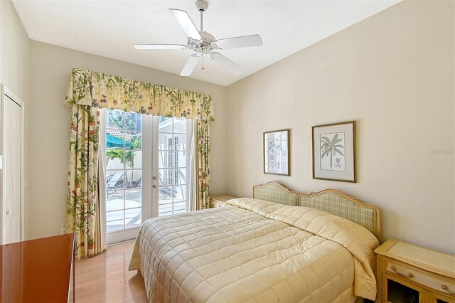 5839 Los Verdes Ct, Bradenton, FL 34210 - bedroom featuring access to outside, light wood-style floors, a ceiling fan, and french doors