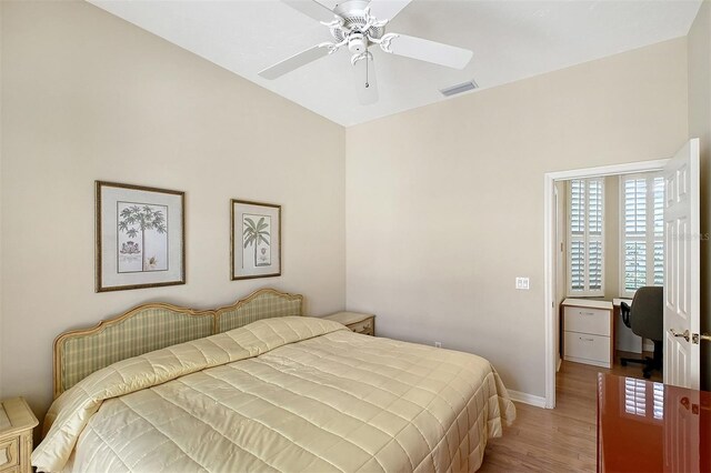 5839 Los Verdes Ct, Bradenton, FL 34210 - bedroom with wood finished floors, ceiling fan, and a desk