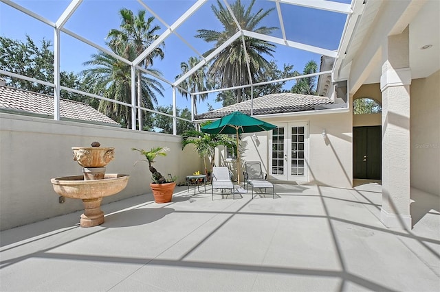 5839 Los Verdes Ct, Bradenton, FL 34210 - view of patio / terrace featuring french doors and glass enclosure