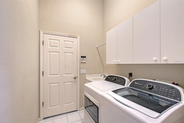 5839 Los Verdes Ct, Bradenton, FL 34210 - washroom with cabinet space, washing machine and dryer, and light tile patterned floors