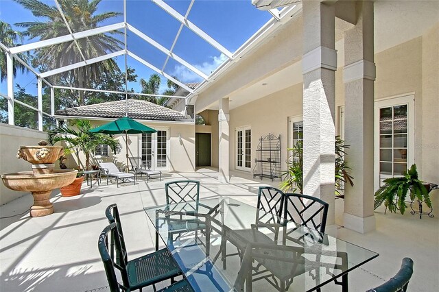 5839 Los Verdes Ct, Bradenton, FL 34210 - view of patio featuring french doors and glass enclosure