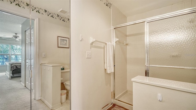 4211 Caddie Dr E Unit 202, Bradenton, FL 34203 - ensuite bathroom featuring a stall shower and a ceiling fan