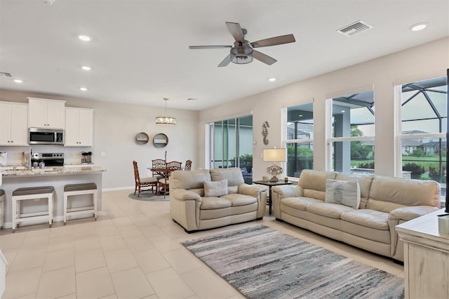 12564 Night View Dr, Sarasota, FL 34238 - living room featuring ceiling fan and recessed lighting