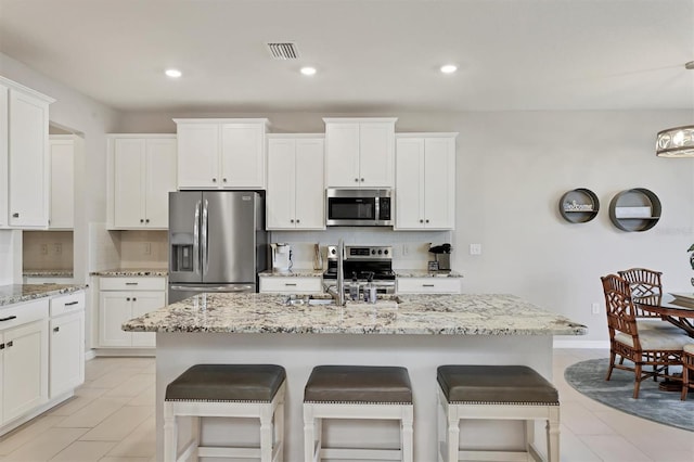 12564 Night View Dr, Sarasota, FL 34238 - kitchen featuring stainless steel appliances, white cabinets, and recessed lighting