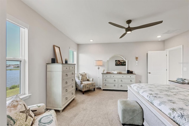 12564 Night View Dr, Sarasota, FL 34238 - bedroom featuring multiple windows, light colored carpet, a ceiling fan, and recessed lighting