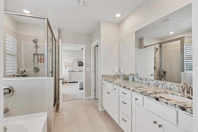 12564 Night View Dr, Sarasota, FL 34238 - ensuite bathroom with a shower stall, double vanity, healthy amount of natural light, recessed lighting, and a tub