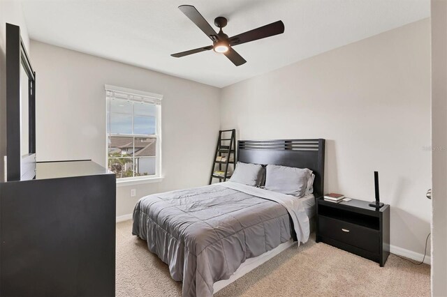 12564 Night View Dr, Sarasota, FL 34238 - bedroom featuring light colored carpet and a ceiling fan