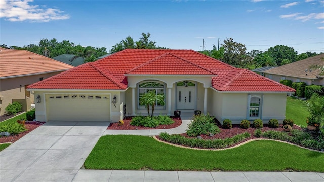 2148 Date Palm Way, Venice, FL 34292 - mediterranean / spanish-style house featuring a tiled roof, a garage, stucco siding, and a front lawn
