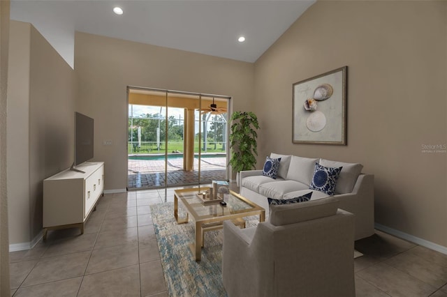 2148 Date Palm Way, Venice, FL 34292 - living room with vaulted ceiling, light tile patterned flooring, and recessed lighting