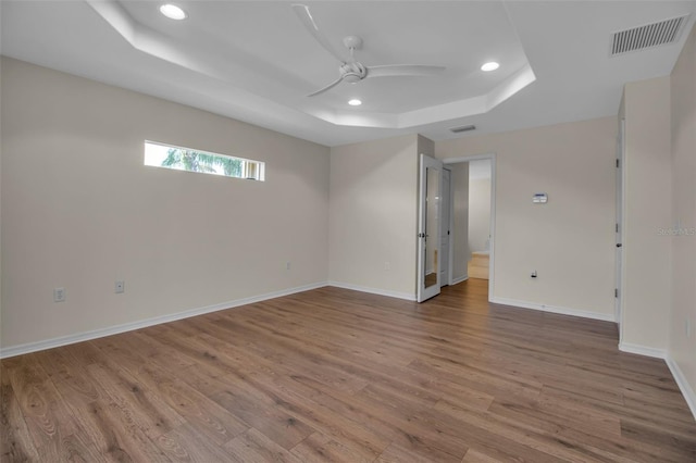 2148 Date Palm Way, Venice, FL 34292 - unfurnished room with a raised ceiling, recessed lighting, wood finished floors, and ceiling fan