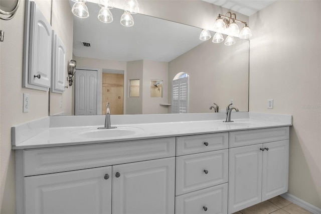 2148 Date Palm Way, Venice, FL 34292 - bathroom with double vanity and tile patterned floors