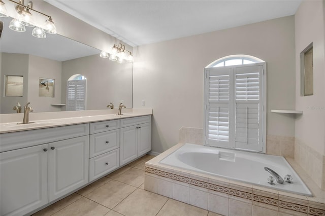 2148 Date Palm Way, Venice, FL 34292 - full bathroom with double vanity, a garden tub, and tile patterned flooring
