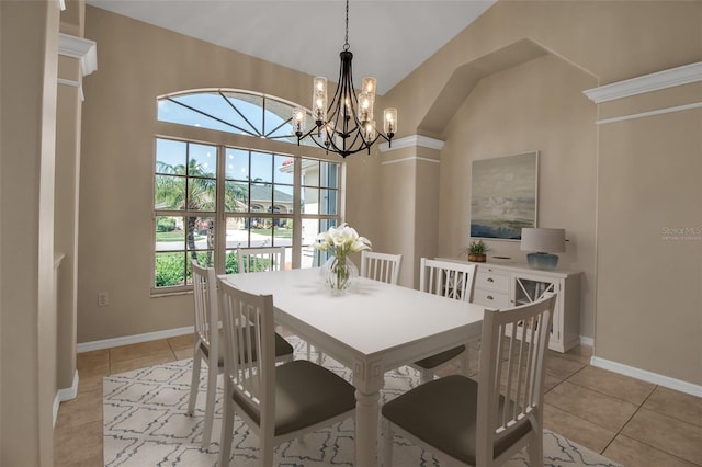 2148 Date Palm Way, Venice, FL 34292 - dining space featuring light tile patterned floors, a chandelier, and vaulted ceiling