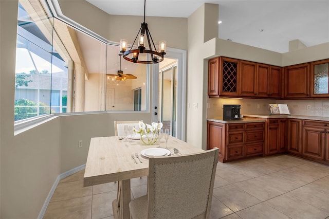 2148 Date Palm Way, Venice, FL 34292 - dining room featuring light tile patterned floors and a chandelier