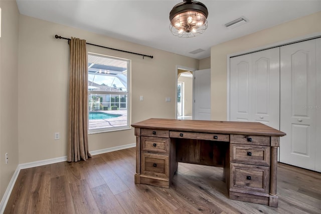 2148 Date Palm Way, Venice, FL 34292 - unfurnished office featuring wood finished floors and arched walkways