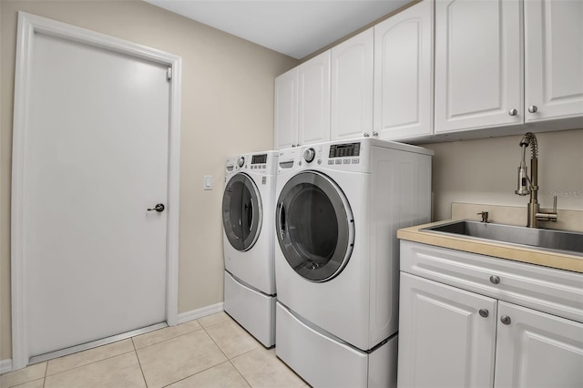 2148 Date Palm Way, Venice, FL 34292 - laundry room with cabinet space, washer and dryer, and light tile patterned floors