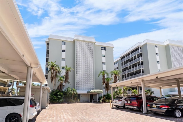 6312 Midnight Pass Rd Unit 102S, Sarasota, FL 34242 - view of building exterior with covered and uncovered parking